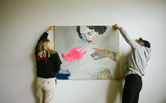students with a painting